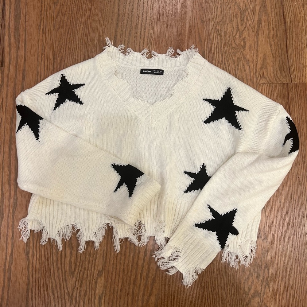 RIPPED STAR SWEATER